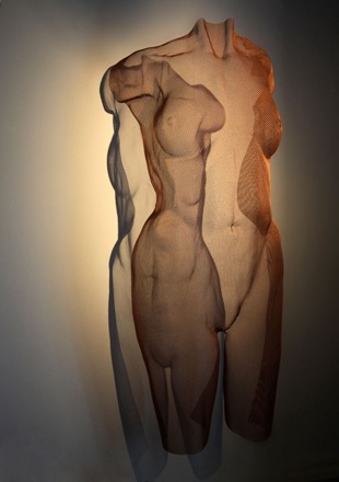 copper-coloured sculpture of a nude body torso